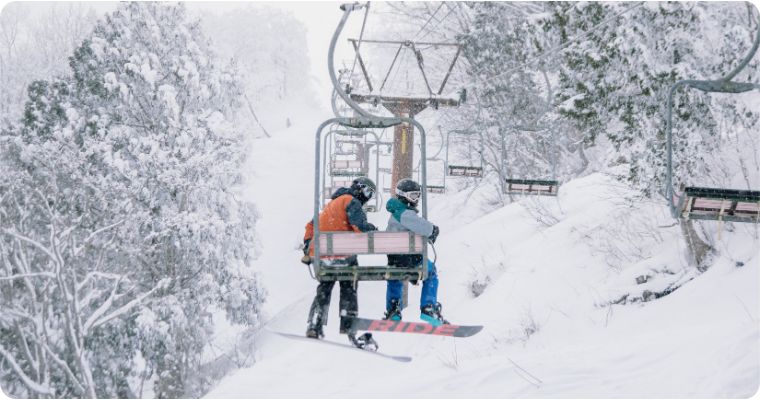 couple on a ski lift in Hakuba Japan 