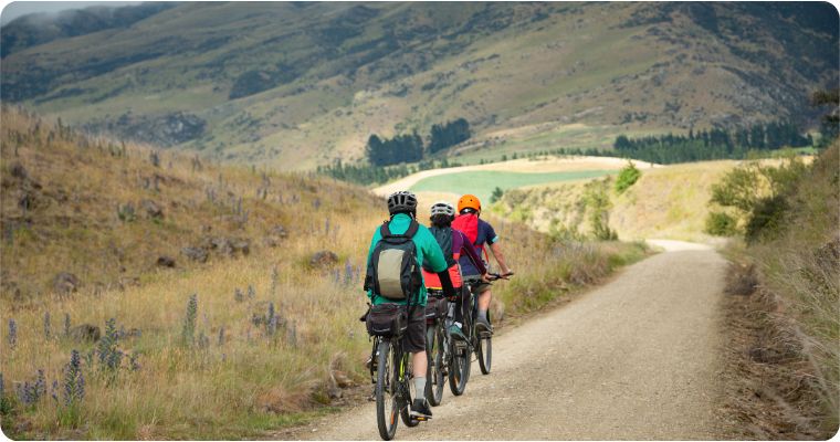 group of bike riders on the Otago Central rail trail in the South Island New Zealand 