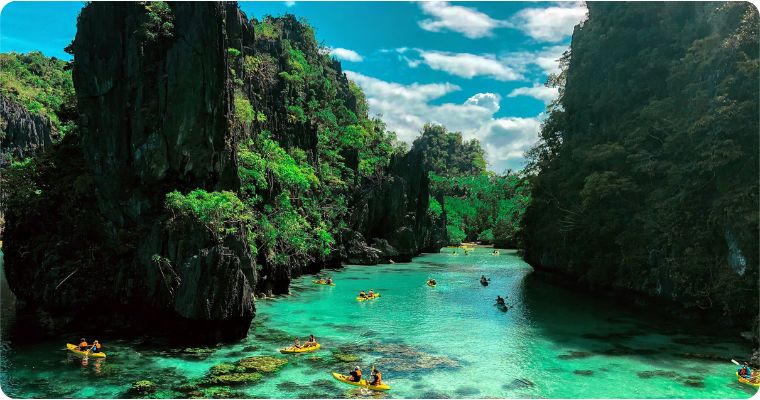 Group of kayakers on Puerto Princesa Subterranean River in the Philippines 