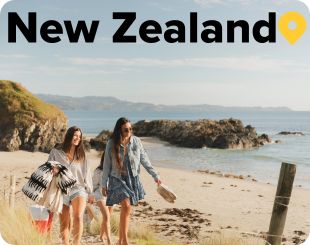 Ladies walking on a beach in Auckland 