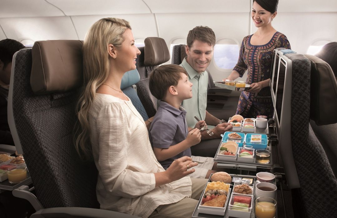 people-enjoying-meal-on-plane