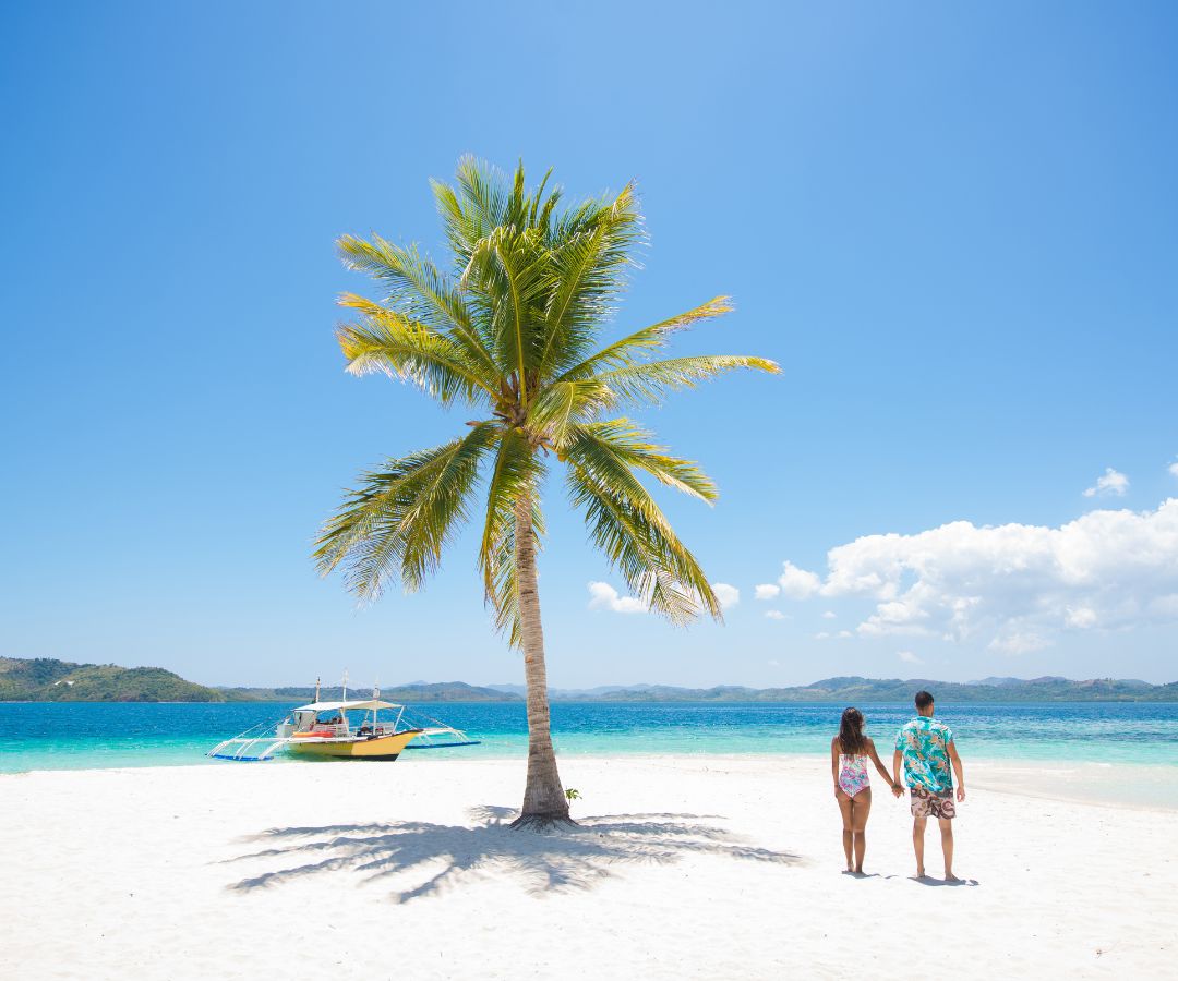 A-boat-is-ankered-off-a-beach-in-Fiji