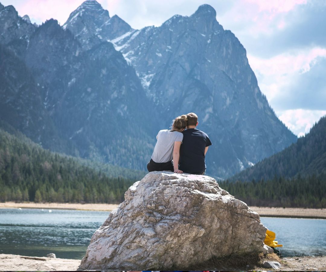 couple sitting rock