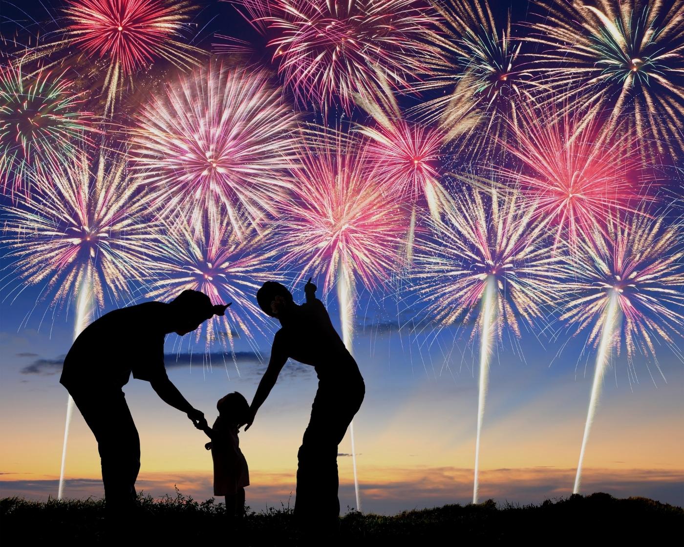 family-looking-at-fireworks